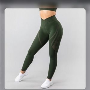 Brand new medium Alphalete surface path laser cut leggings in olive.